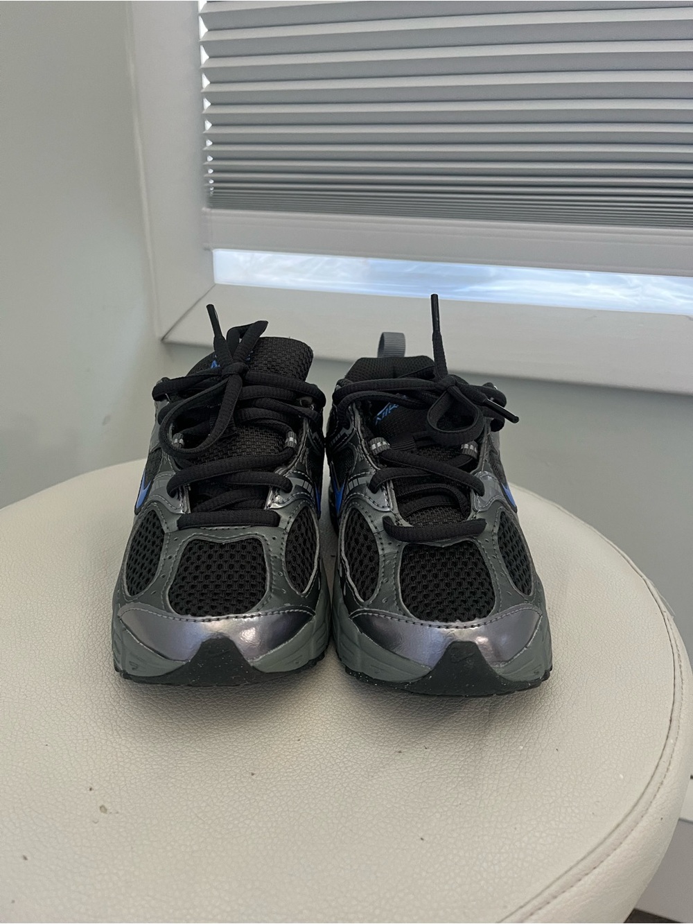 Nike Kids Black and Metallic Gray Sneakers with Blue Swoosh
